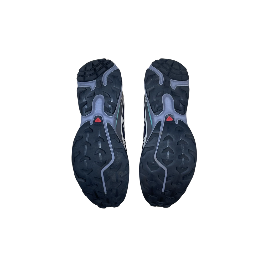 Zenno Archive Salomon XT-6 Nine Iron Waterfall sneakers showing the black rubber lugged outsoles from below