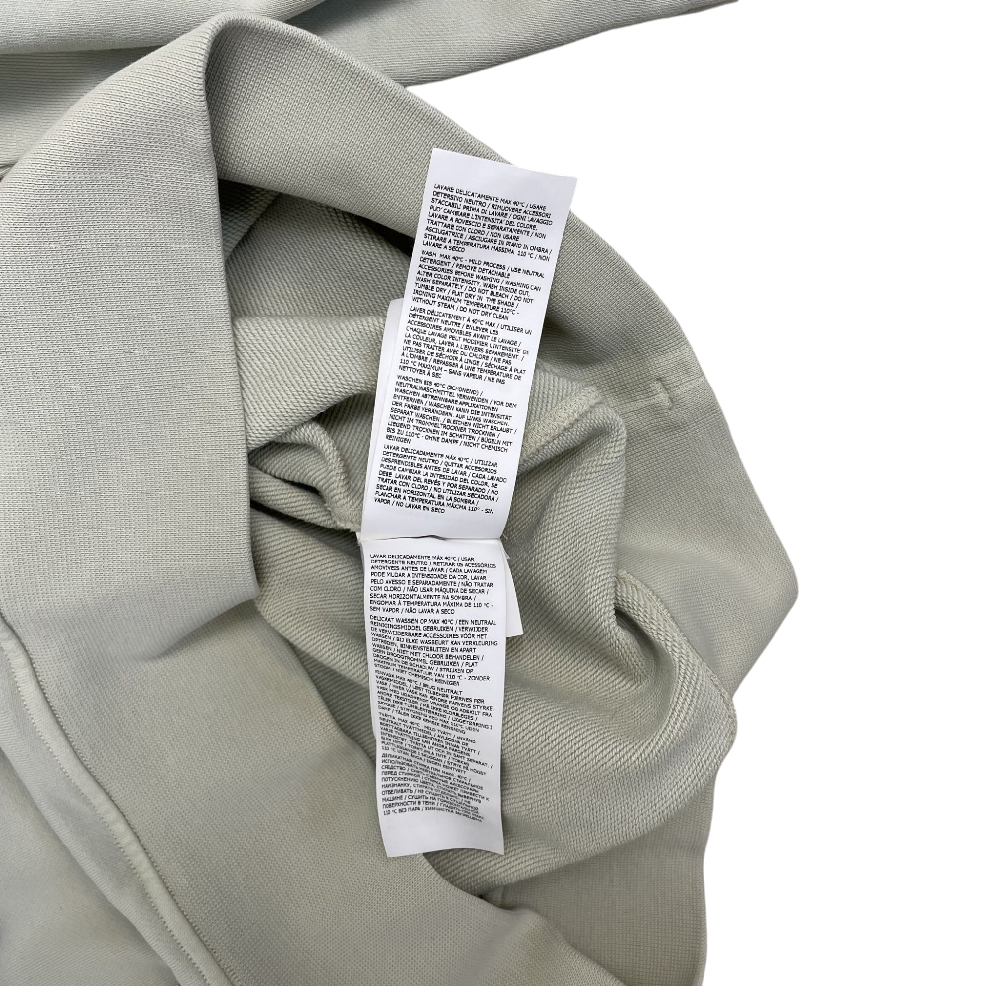 Zenno Archive Stone Island garment-dyed quarter-zip sweatshirt care label with multi-language washing instructions