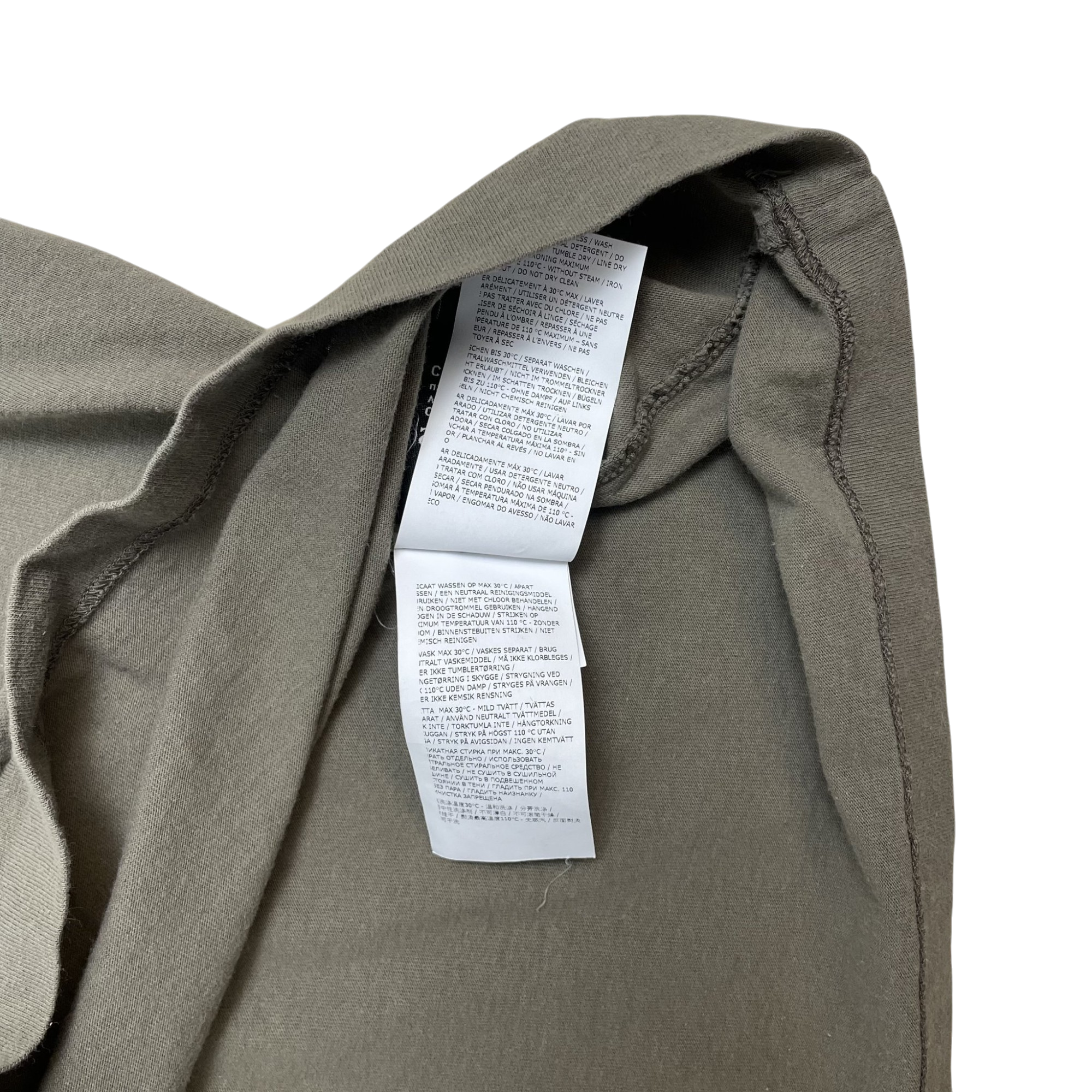 Zenno Archive Stone Island green t-shirt interior care label with multi-language washing instructions