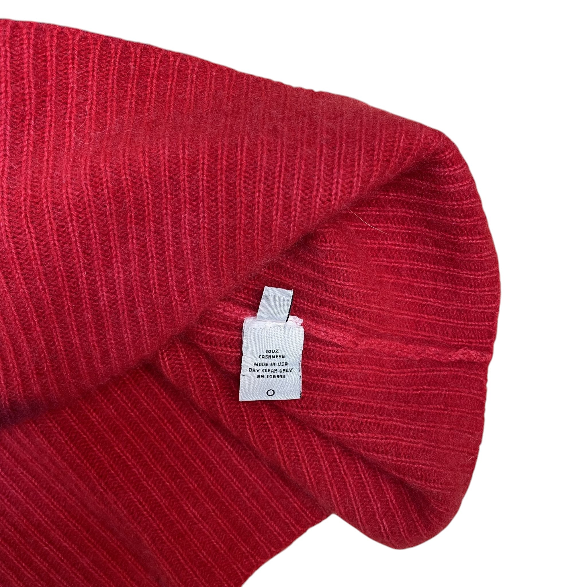 Zenno Archive The Elder Statesman red cashmere cardigan with care label detail showing 100 percent cashmere material