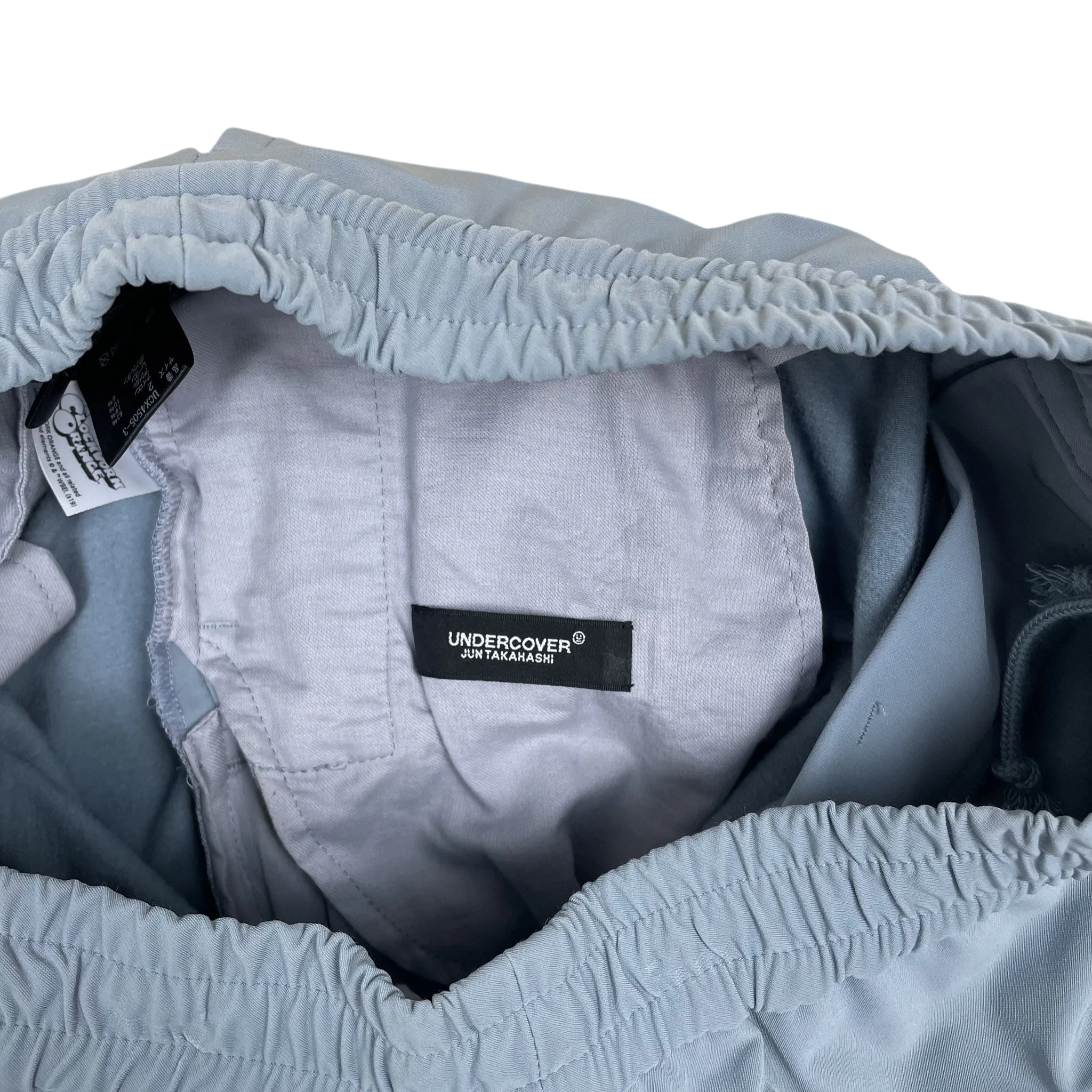 Zenno Archive Undercover Jun Takahashi A Clockwork Orange track pants interior label and elastic waistband