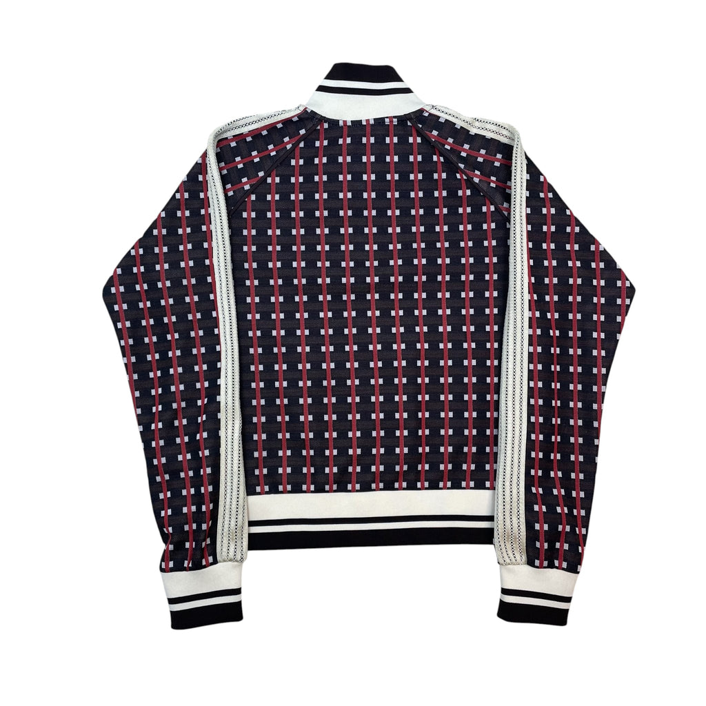 Zenno Archive Wales Bonner brown and red patterned track jacket with white striped sleeves and ribbed cuffs